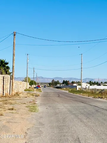 a view of a swimming pool and an outdoor space