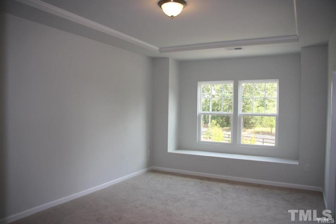 2919 Sunflower Road Apex, NC 27502 - Photo 19 of 34 a view of an empty room with a window