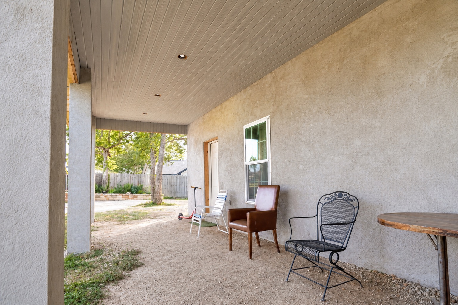 158 Buena Fortuna Road Elgin, TX 78621 - Photo 17 of 40 An inviting covered patio area offers a cool retreat, perfect for outdoor relaxation.