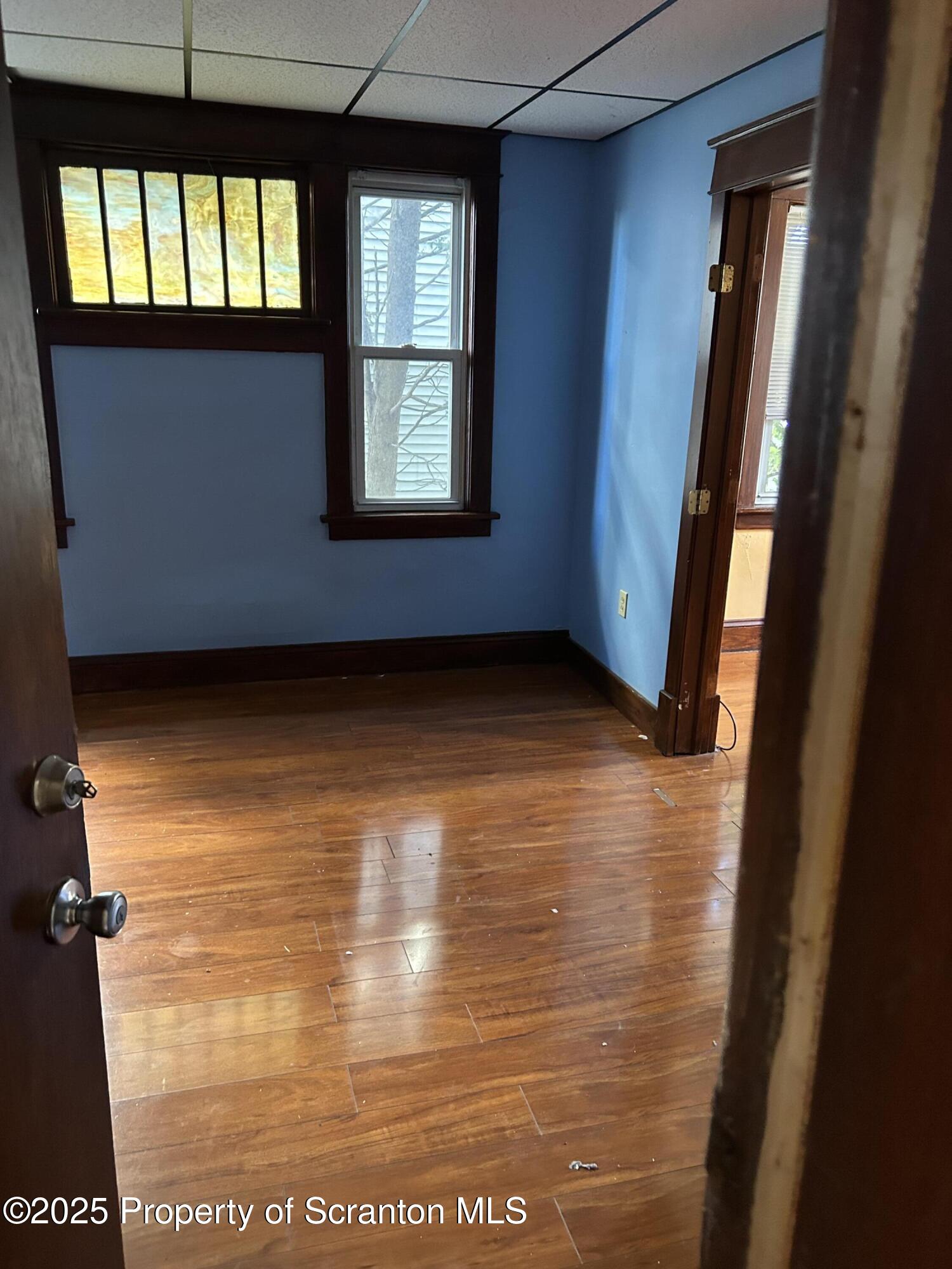 510 Moltke Avenue, Unit FIRST FLOOR #1 Scranton, PA 18505 - Photo 9 of 27 a view of an empty room with wooden floor and a window