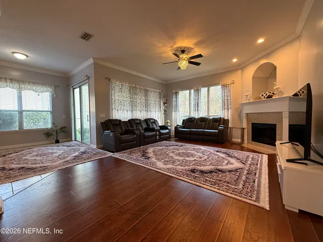 a living room with furniture and a fireplace