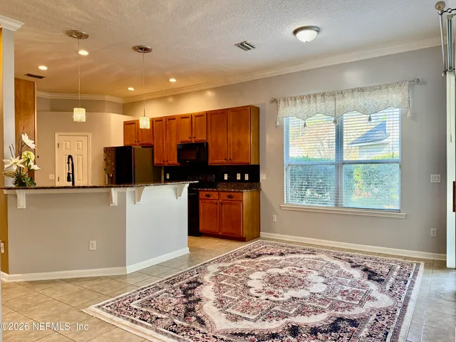 a view of a living room and dining room
