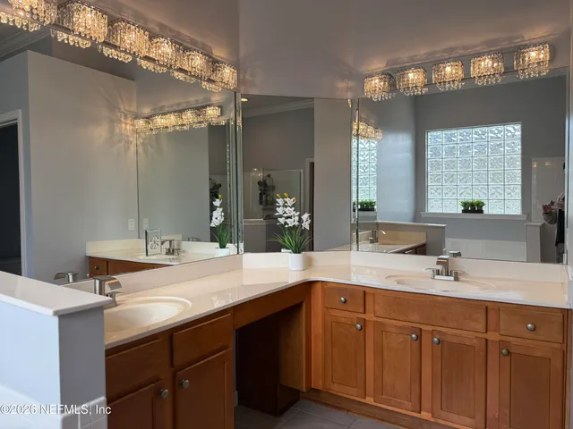 a bathroom with a sink double vanity and a mirror