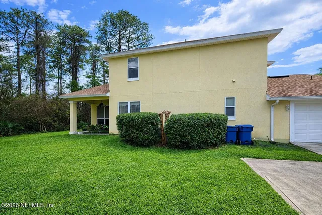 a view of a house with a garden