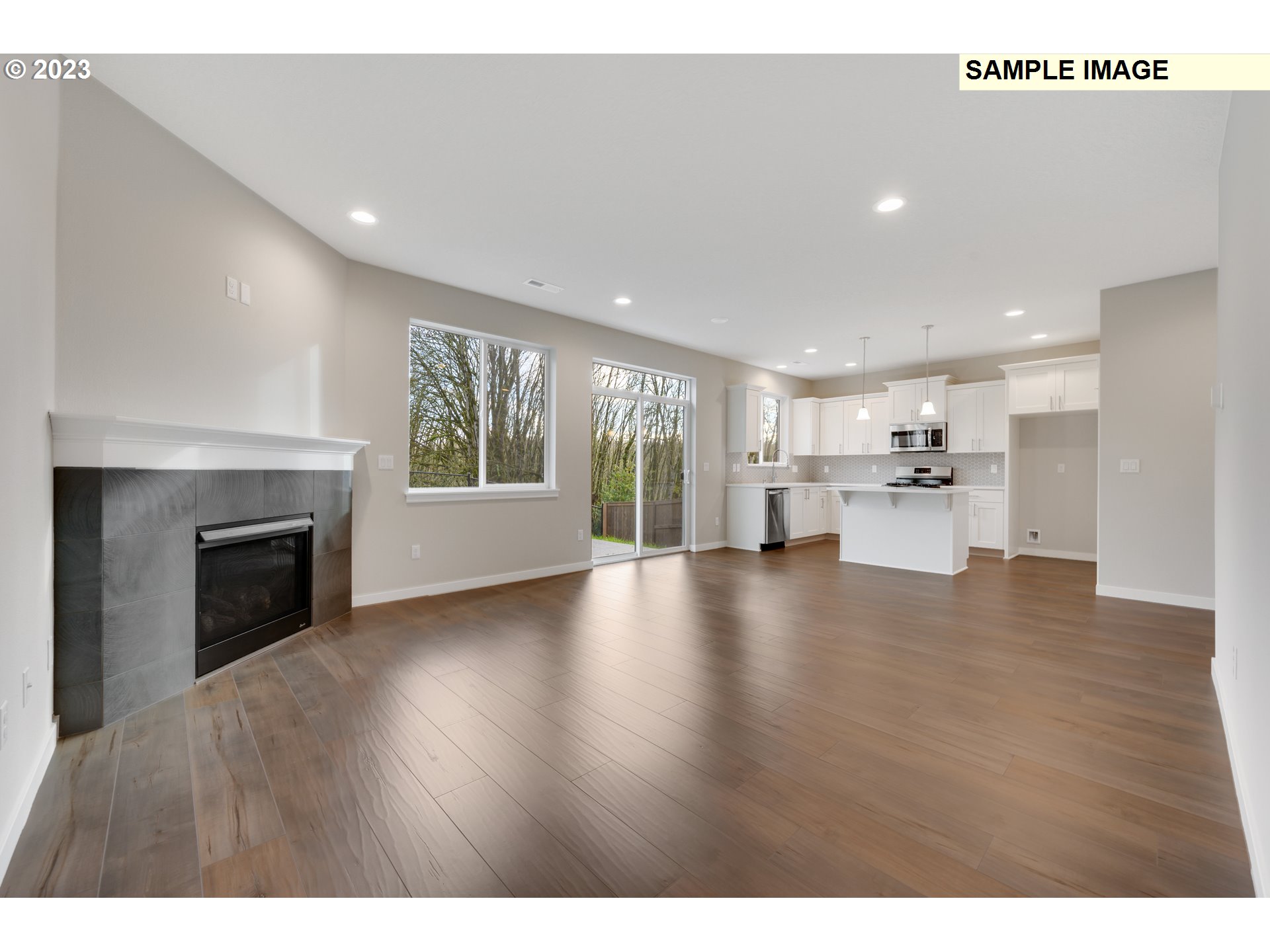 16881 Southeast Mist Layer Loop, Unit 531 Happy Valley, OR 97086 - Photo 23 of 32 a view of kitchen with furniture and wooden floor