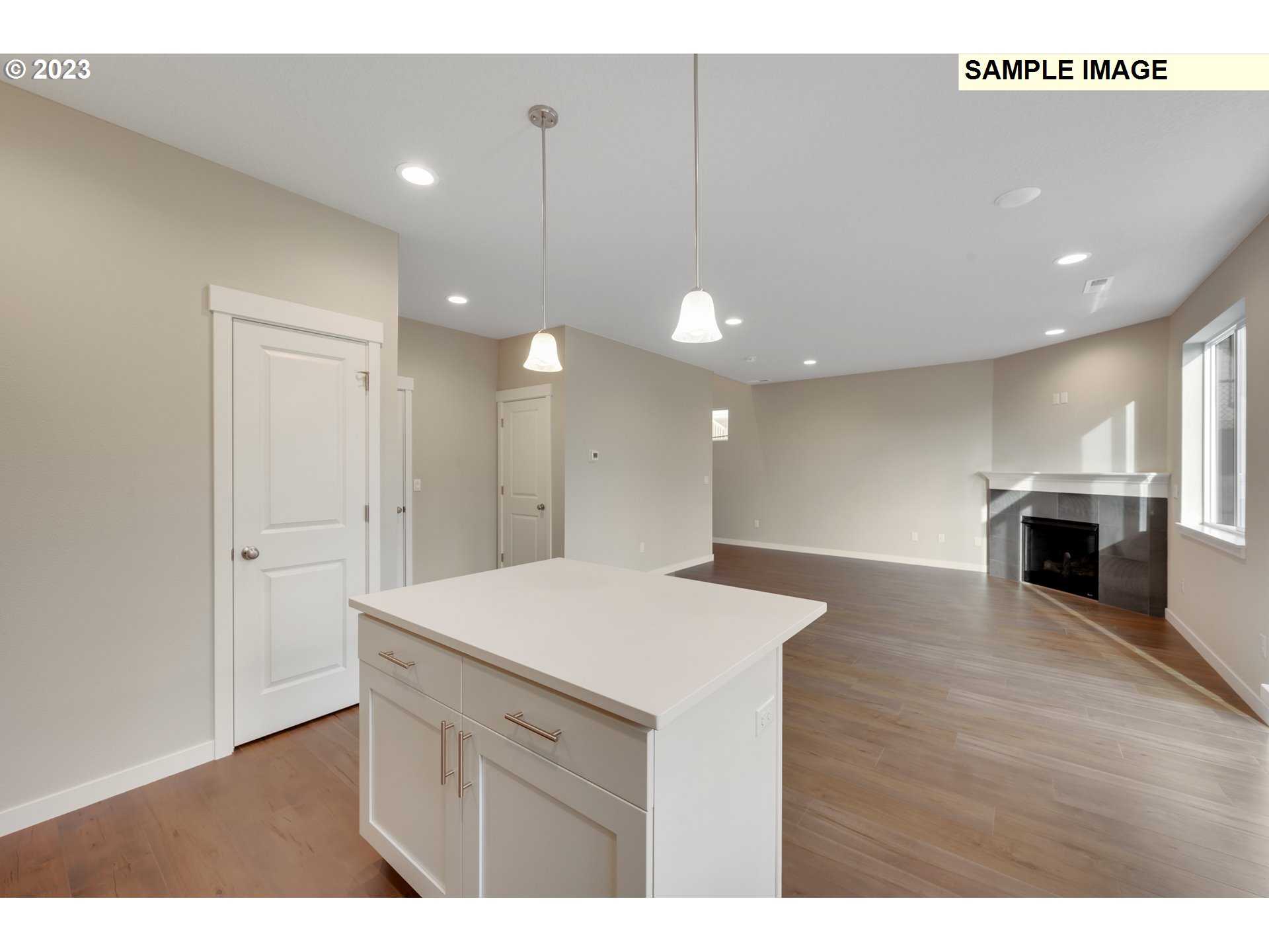 16881 Southeast Mist Layer Loop, Unit 531 Happy Valley, OR 97086 - Photo 26 of 32 a kitchen with a sink a stove and kitchen island