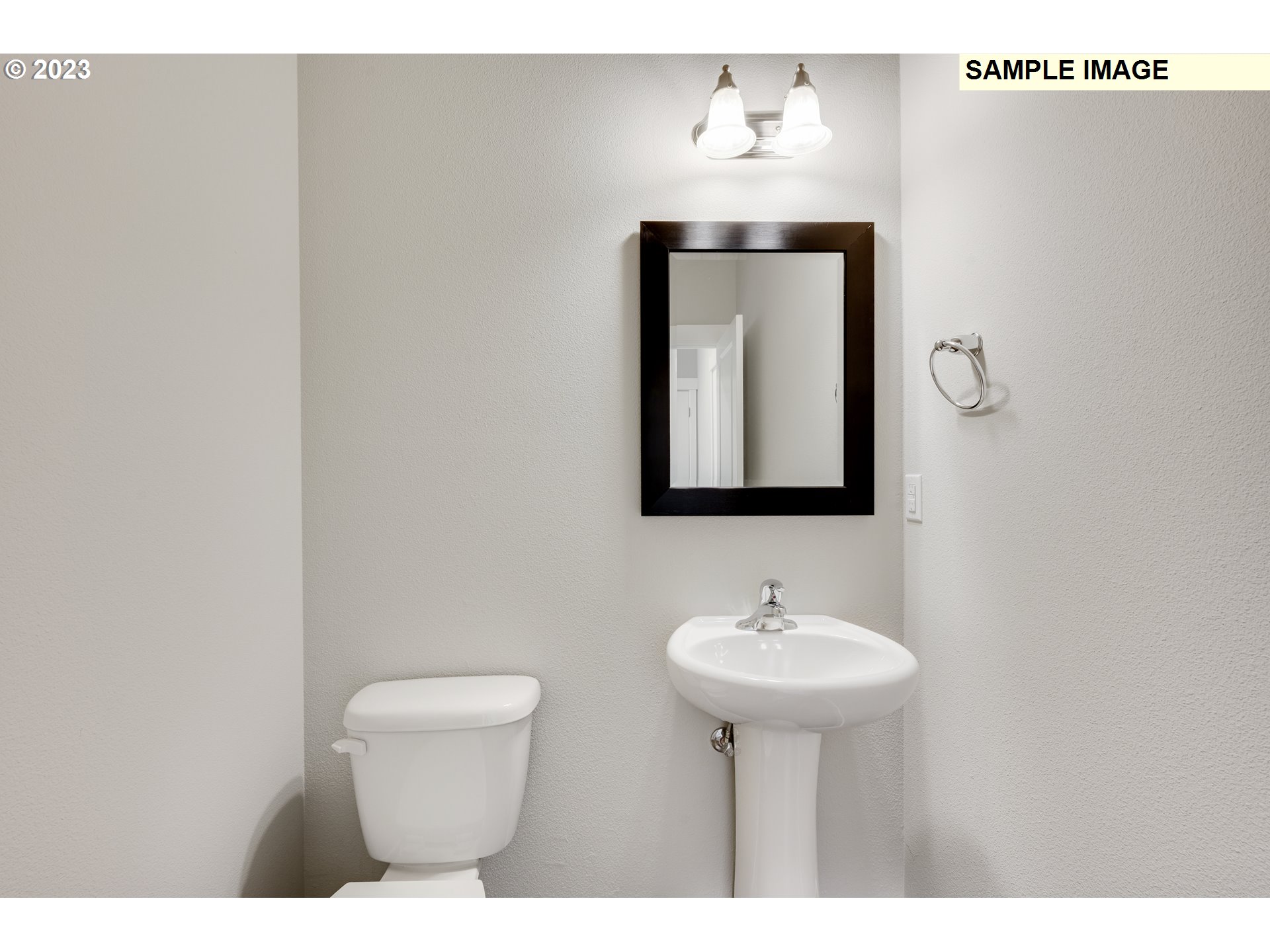 16881 Southeast Mist Layer Loop, Unit 531 Happy Valley, OR 97086 - Photo 29 of 32 a bathroom with a toilet sink and mirror