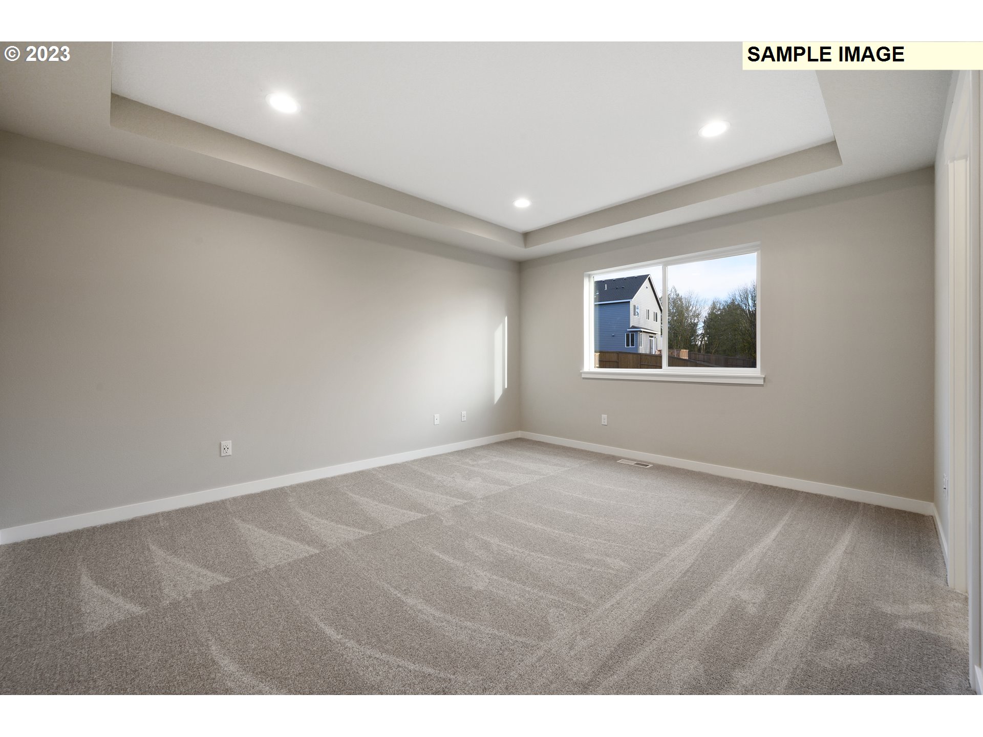 16881 Southeast Mist Layer Loop, Unit 531 Happy Valley, OR 97086 - Photo 8 of 32 a view of an empty room with wooden floor and a window