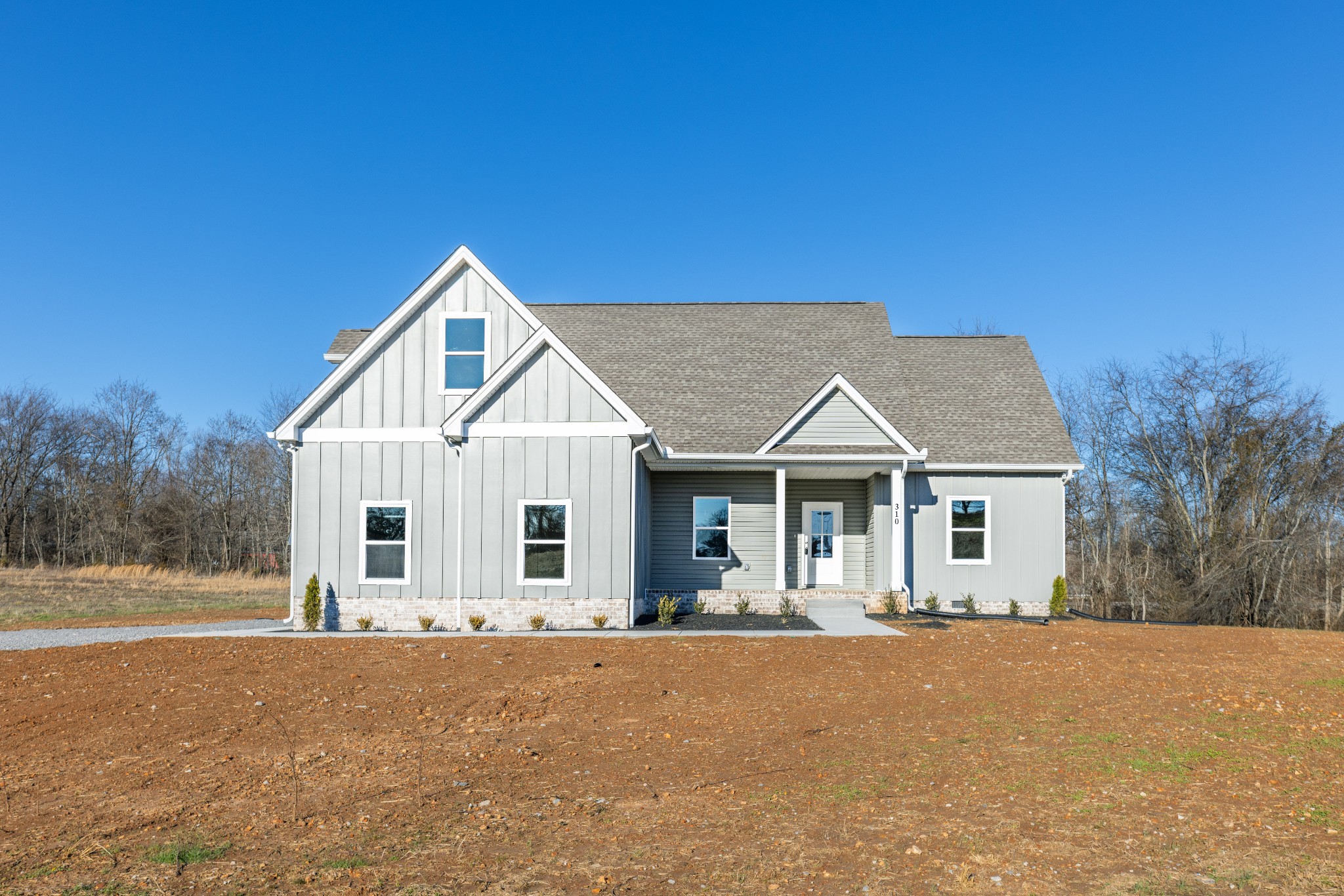 310 Woodruff Road Adams, TN 37010 - Photo 1 of 14 a view of a house with a yard and large tree