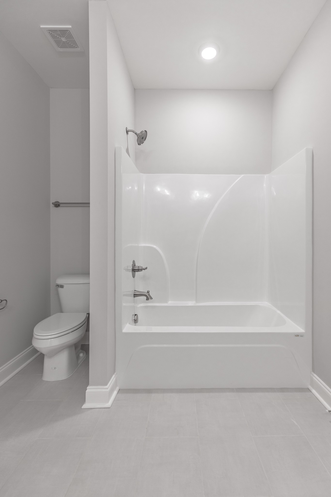 310 Woodruff Road Adams, TN 37010 - Photo 11 of 14 a bathroom with a toilet and a bathtub