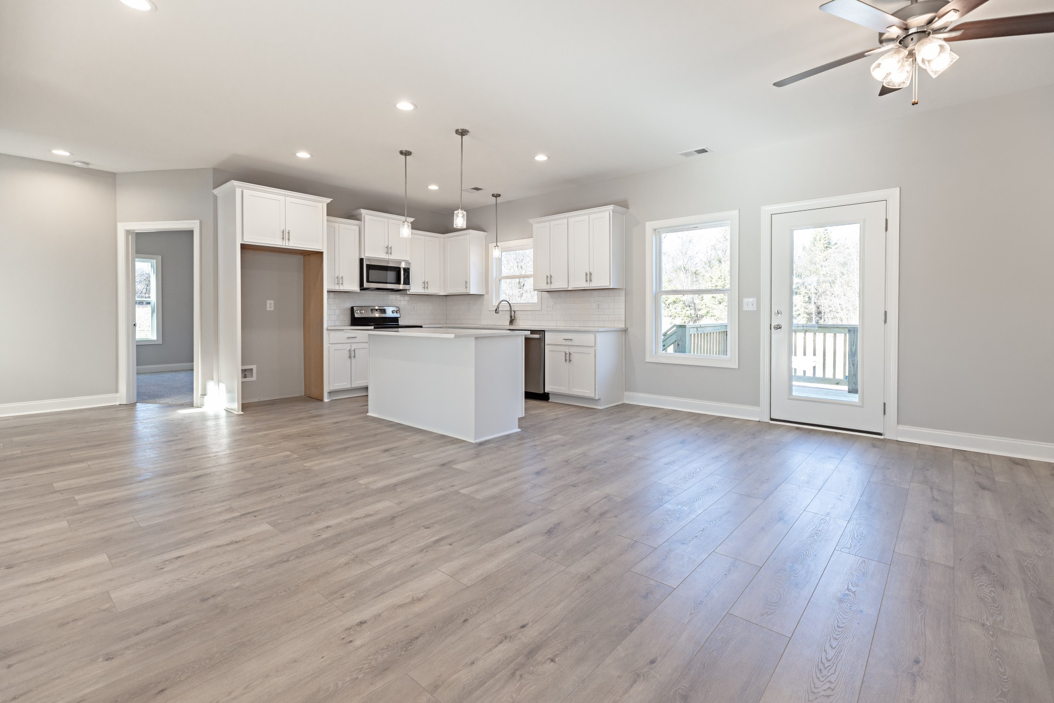 310 Woodruff Road Adams, TN 37010 - Photo 4 of 14 a view of kitchen with wooden floor and window