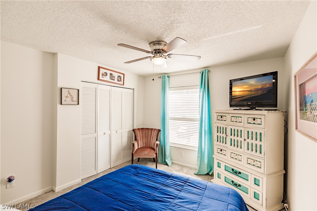 5737 Whitaker Road, Unit C201 Naples, FL 34112 - Photo 20 of 32 a view of room with window and flat screen tv