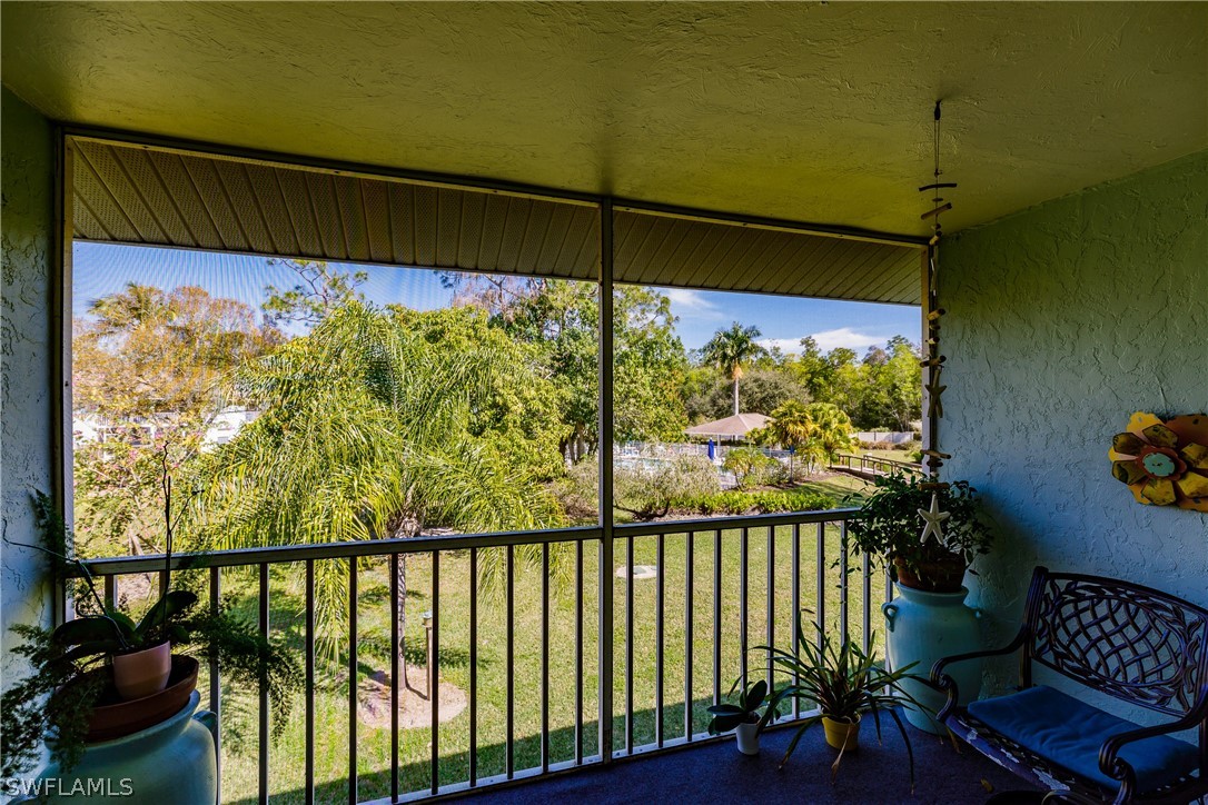 5737 Whitaker Road, Unit C201 Naples, FL 34112 - Photo 27 of 32 a view of a porch