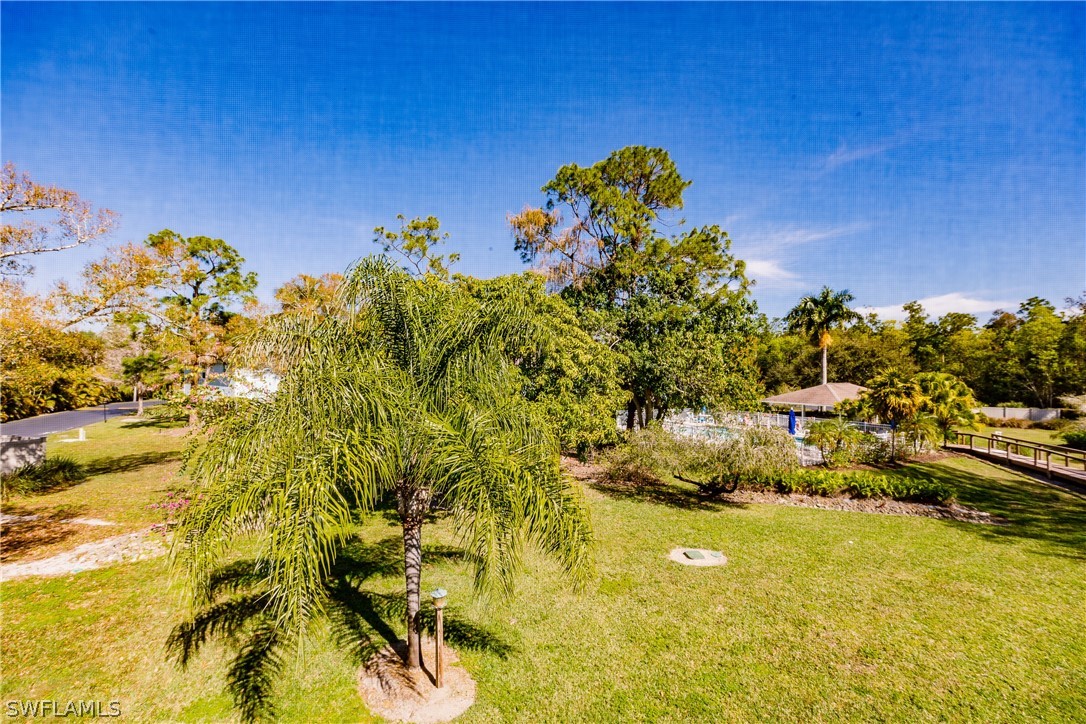 5737 Whitaker Road, Unit C201 Naples, FL 34112 - Photo 28 of 32 a view of a lake