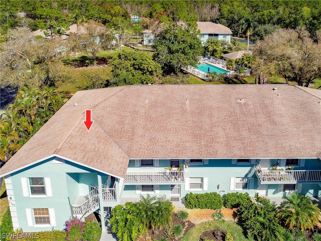 5737 Whitaker Road, Unit C201 Naples, FL 34112 - Photo 29 of 32 an aerial view of a house with a yard