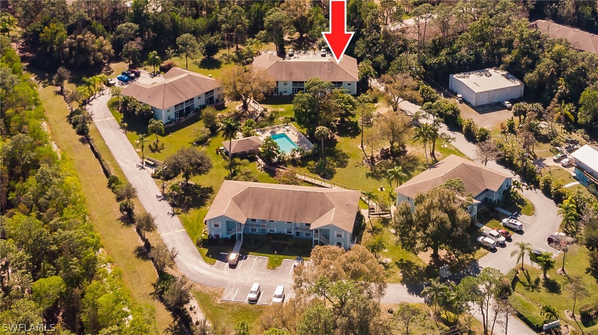 5737 Whitaker Road, Unit C201 Naples, FL 34112 - Photo 30 of 32 an aerial view of residential houses with outdoor space