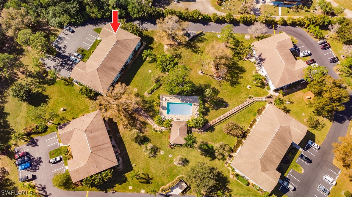 5737 Whitaker Road, Unit C201 Naples, FL 34112 - Photo 32 of 32 an aerial view of a house with a swimming pool