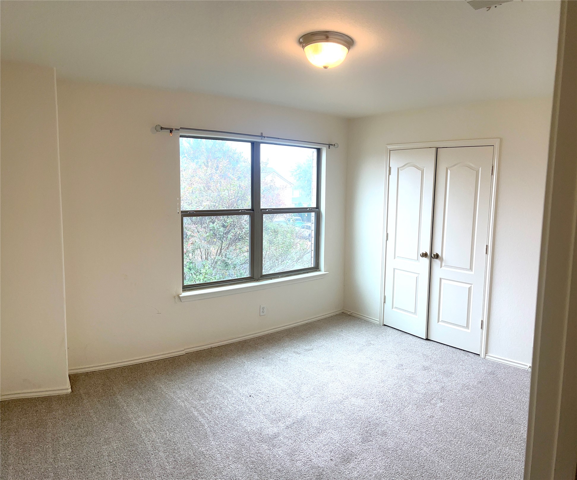 160 Mistletoe Lane Kyle, TX 78640 - Photo 19 of 29 an empty room with windows and closet