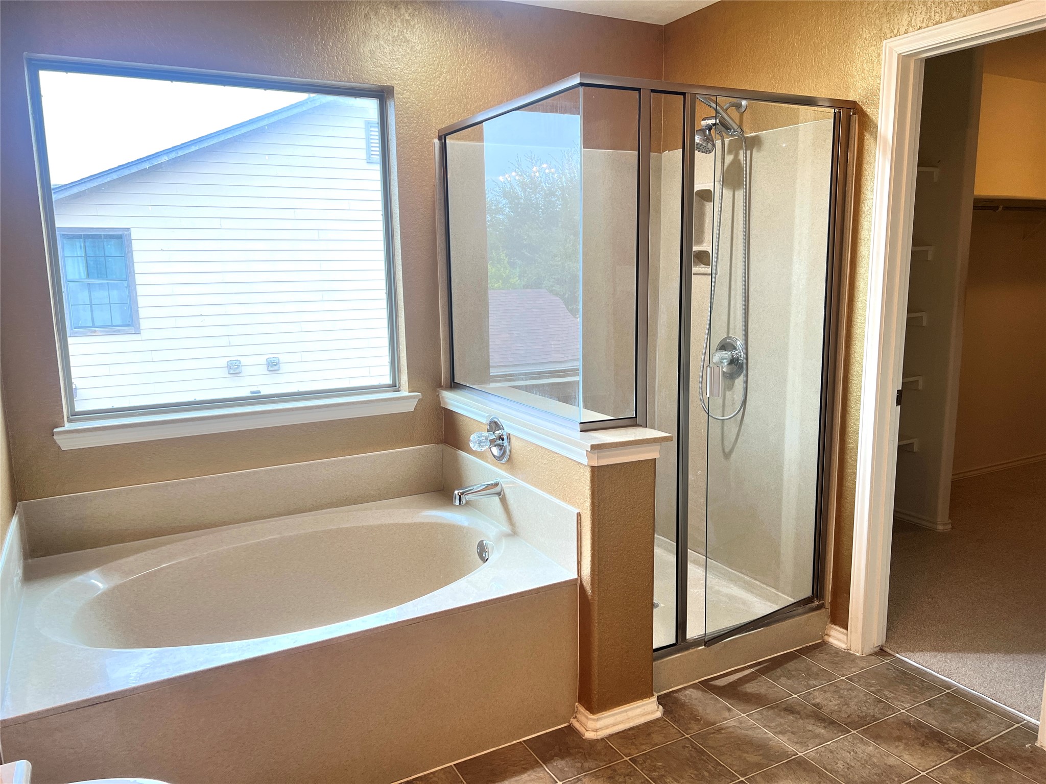 160 Mistletoe Lane Kyle, TX 78640 - Photo 24 of 29 a bathroom with a bathtub and a shower