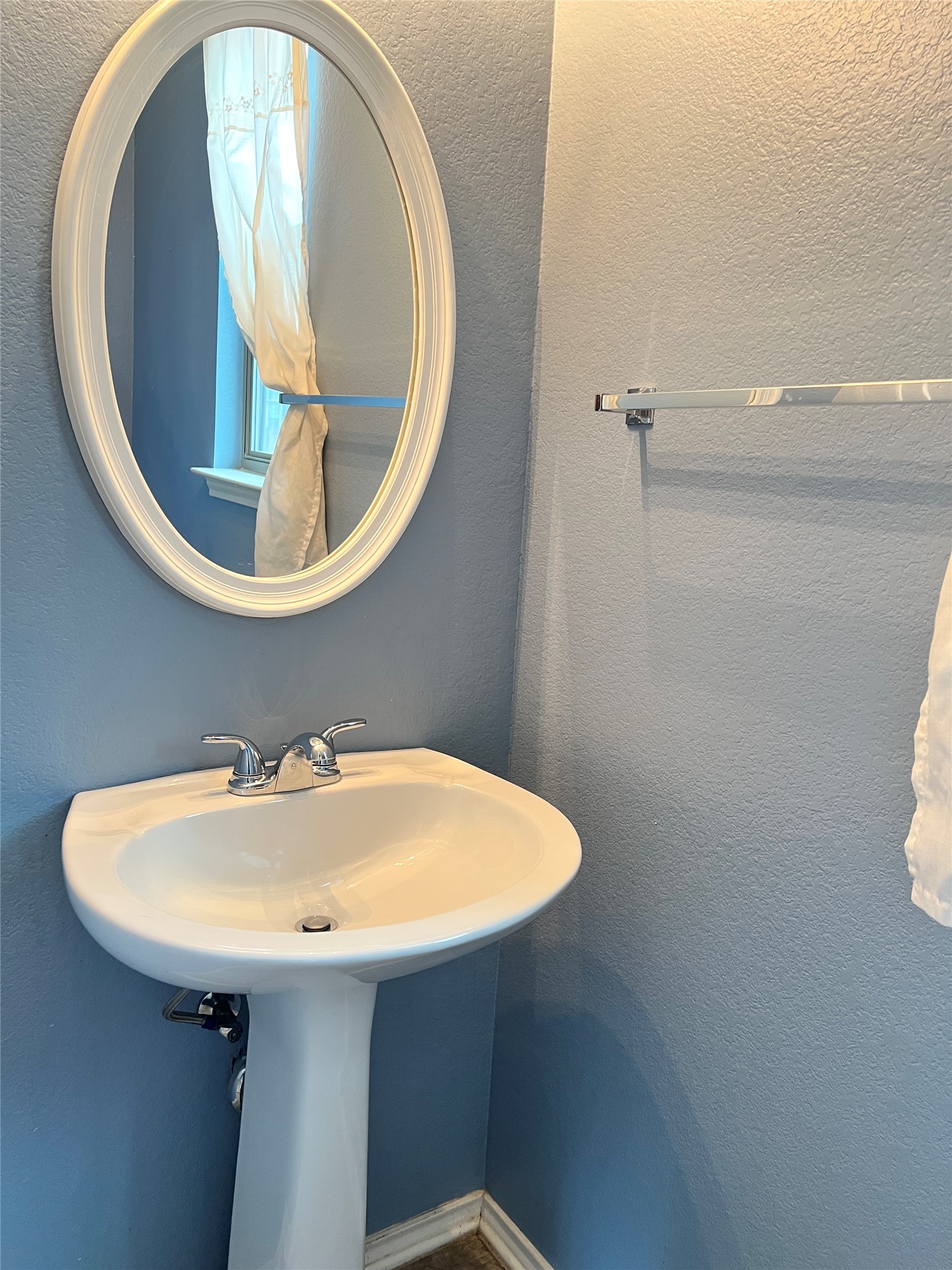 160 Mistletoe Lane Kyle, TX 78640 - Photo 10 of 29 a bathroom with a sink and mirror