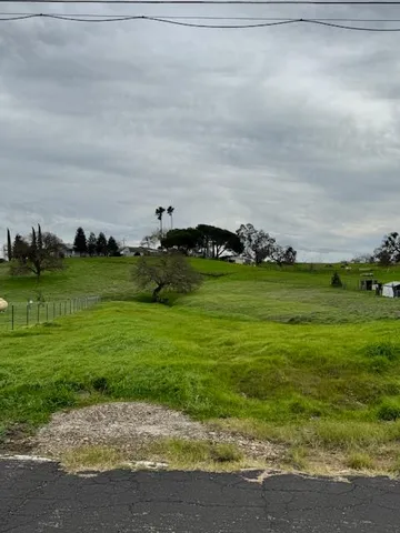 a view of a golf course with a field
