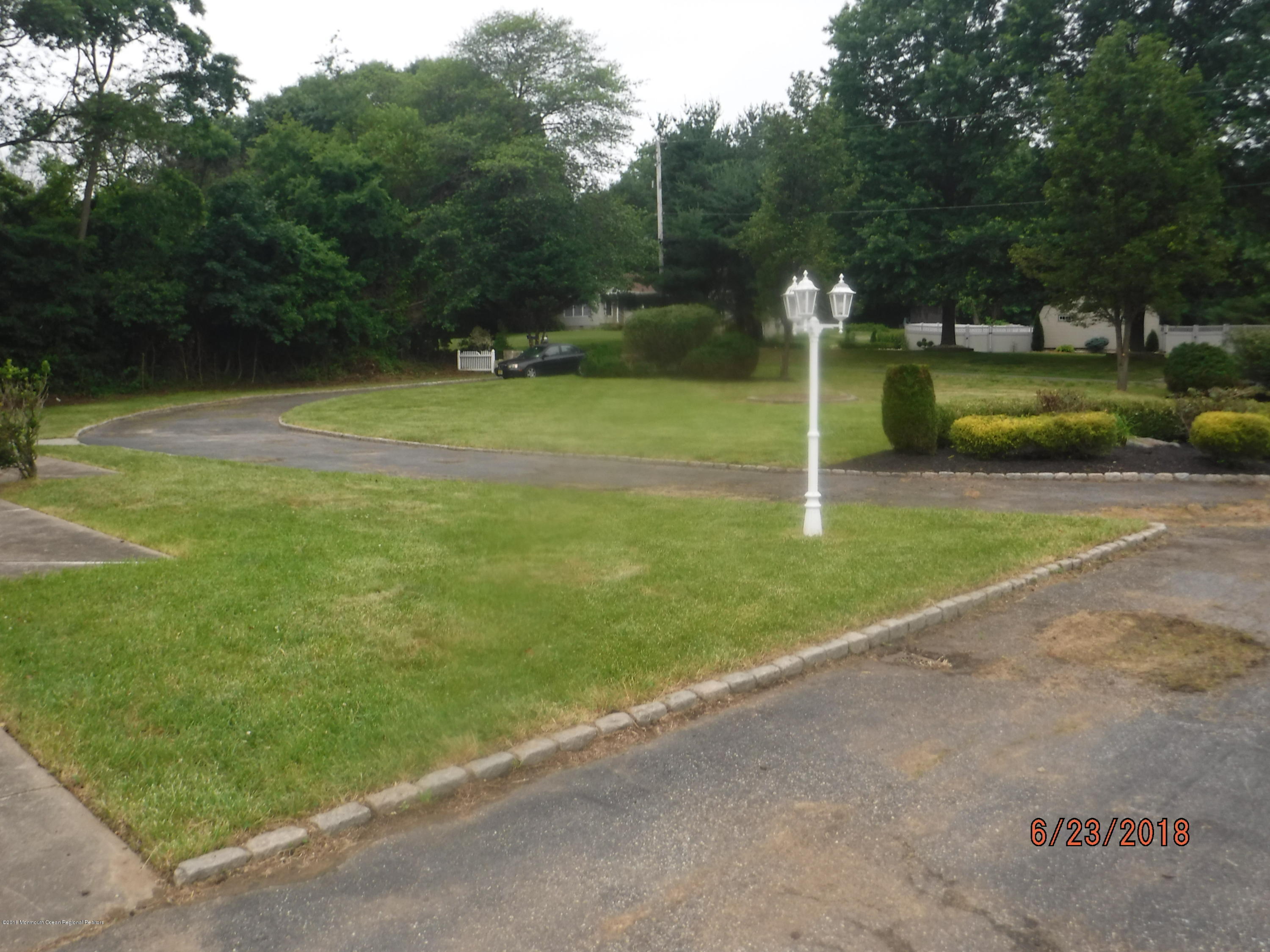 17 Crow Hill Road Freehold, NJ 07728 - Photo 12 of 44 a backyard of a house with portable swimming pool and outdoor seating