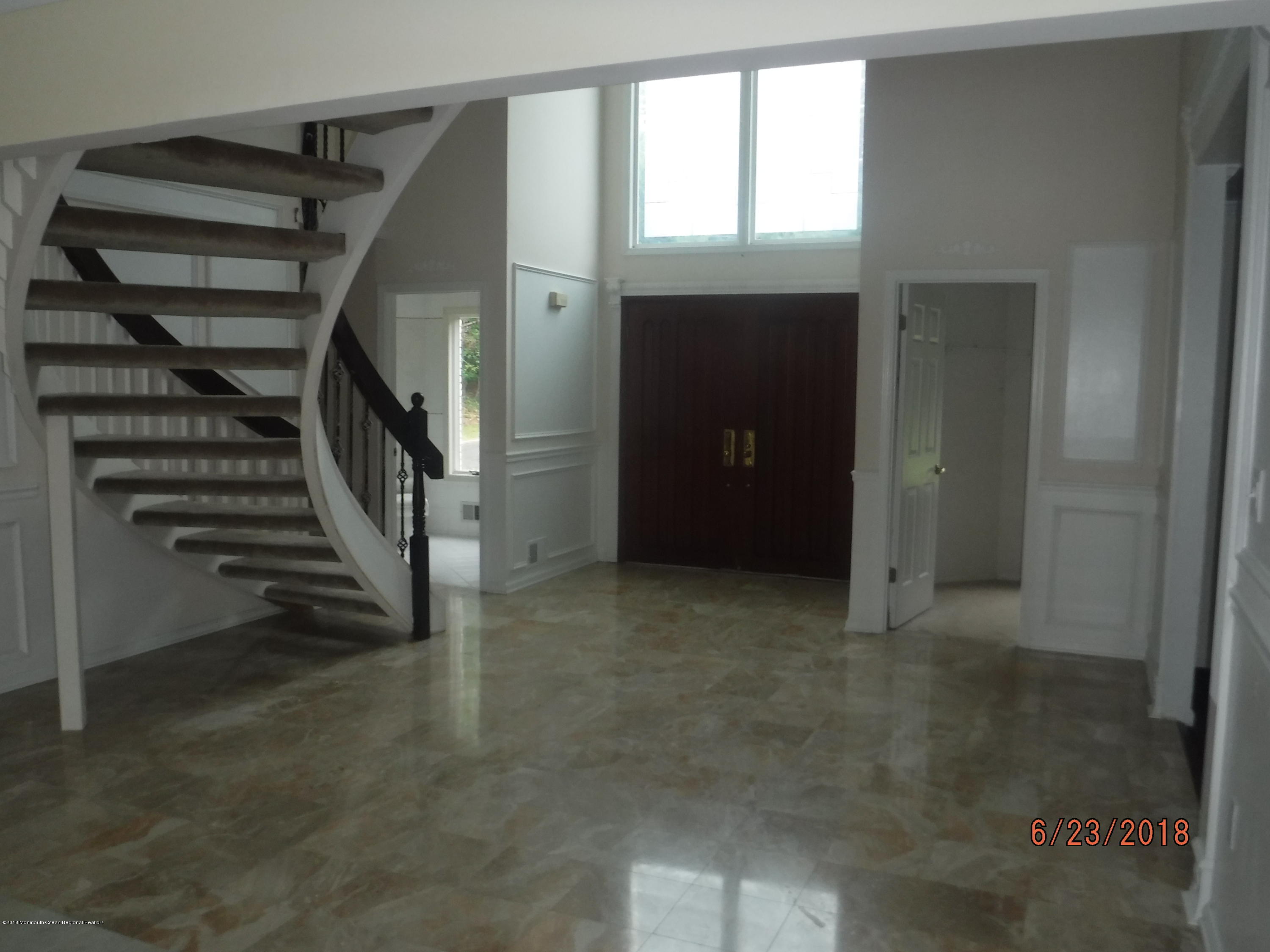 17 Crow Hill Road Freehold, NJ 07728 - Photo 14 of 44 a view of a hallway with stairs and a window