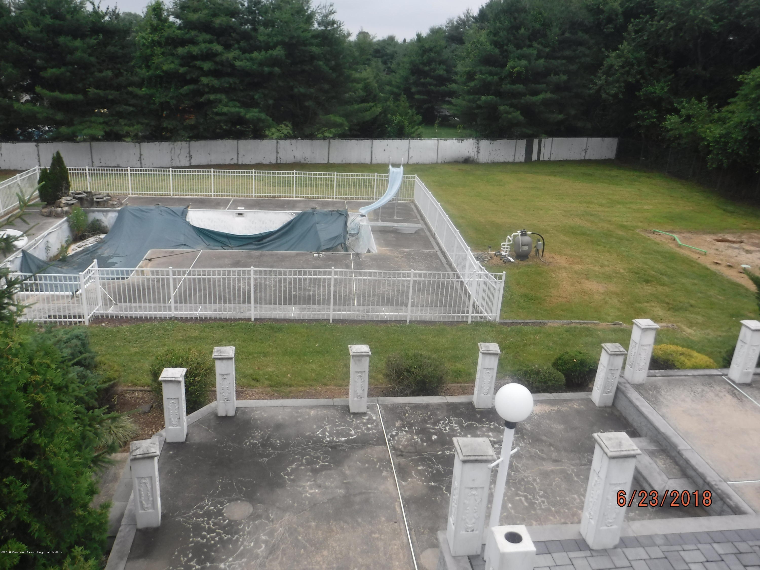 17 Crow Hill Road Freehold, NJ 07728 - Photo 2 of 44 a view of a swimming pool with a patio