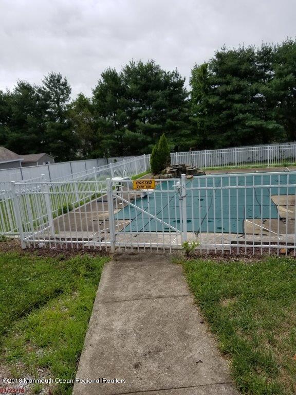 17 Crow Hill Road Freehold, NJ 07728 - Photo 9 of 44 a view of backyard with wooden fence