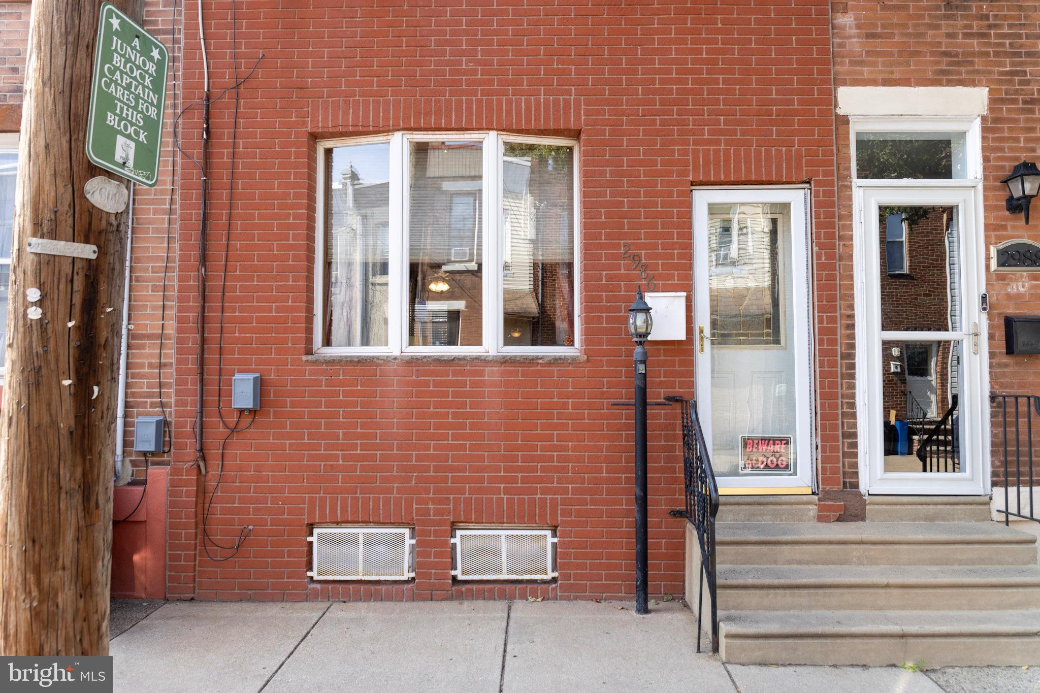 2986 Chatham Street Philadelphia, PA 19134 - Photo 1 of 14 a view of brick building with a bench