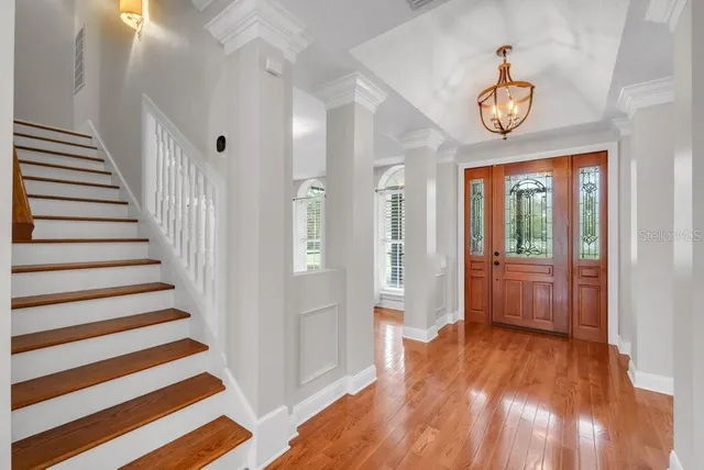 a kitchen with stainless steel appliances granite countertop a sink counter space cabinets and a refrigerator