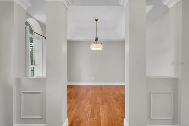 a large kitchen with kitchen island a sink a stove a refrigerator and a cabinets