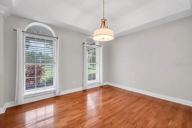 a kitchen with stainless steel appliances white cabinets and a stove