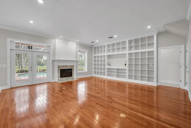 a view of an empty room with a window