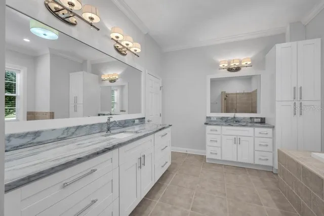 a view of a big building with a big yard and palm trees