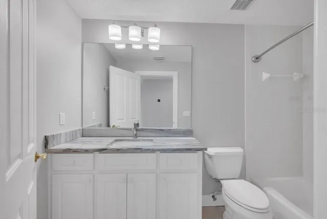 an aerial view of house with yard swimming pool and outdoor seating