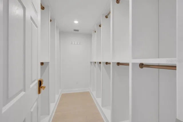 an aerial view of residential house with swimming pool and green space