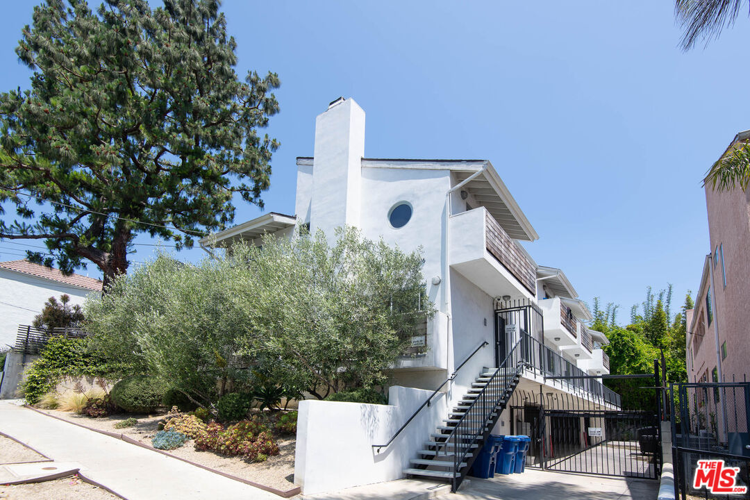 1016 Sanborn Avenue, Unit 101 Los Angeles, CA 90029 - Photo 18 of 18 a front view of a house with a yard