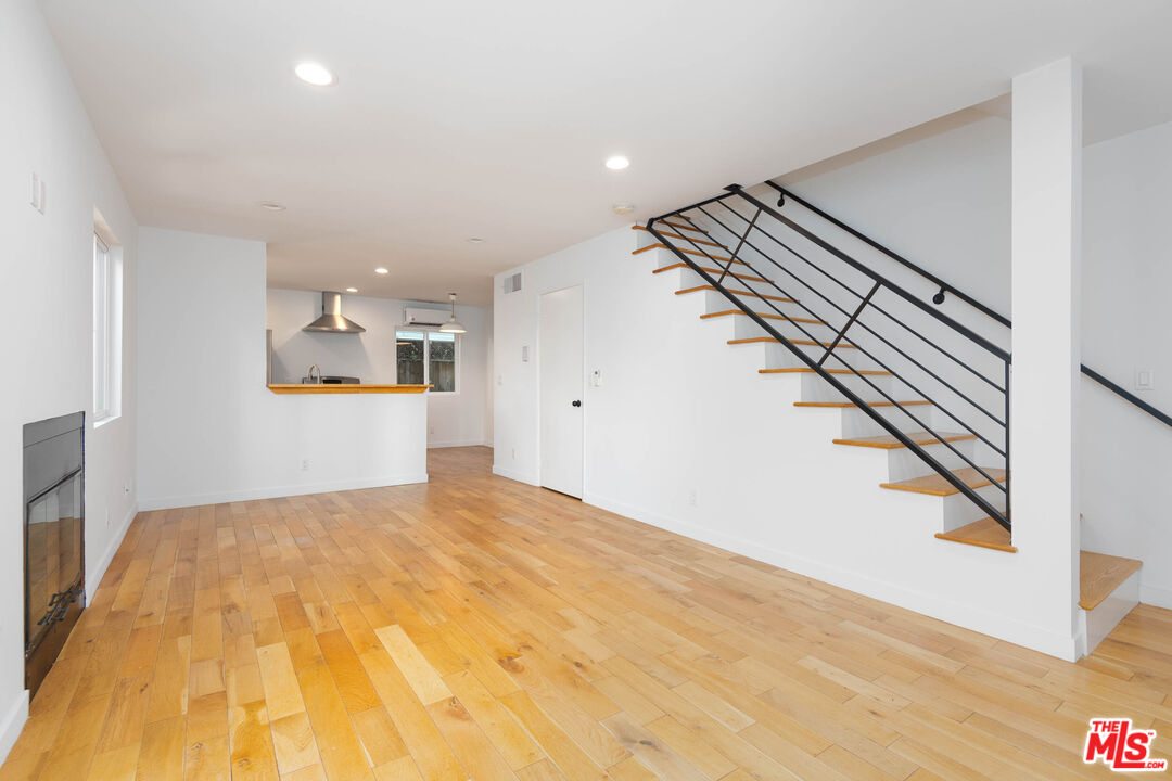 1016 Sanborn Avenue, Unit 101 Los Angeles, CA 90029 - Photo 3 of 18 a view of a big room with wooden floor and entryway