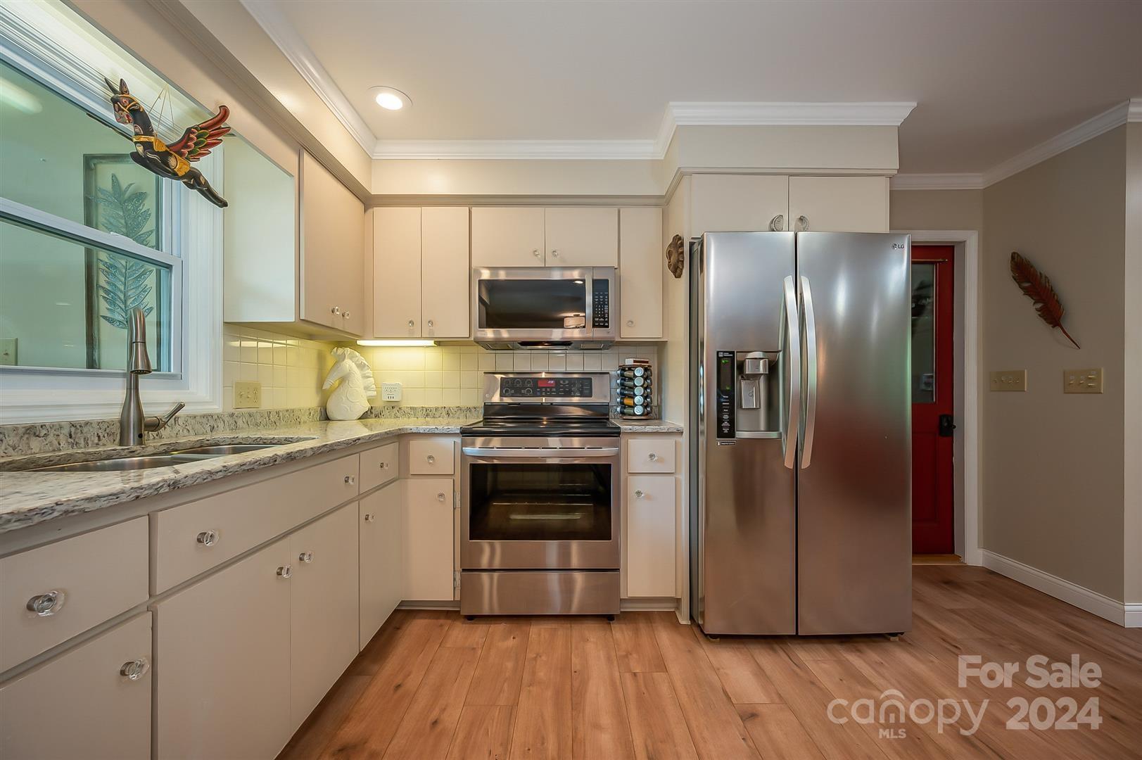 2316 Golf Course Road Columbus, NC 28722 - Photo 12 of 33 a kitchen with a refrigerator sink and microwave