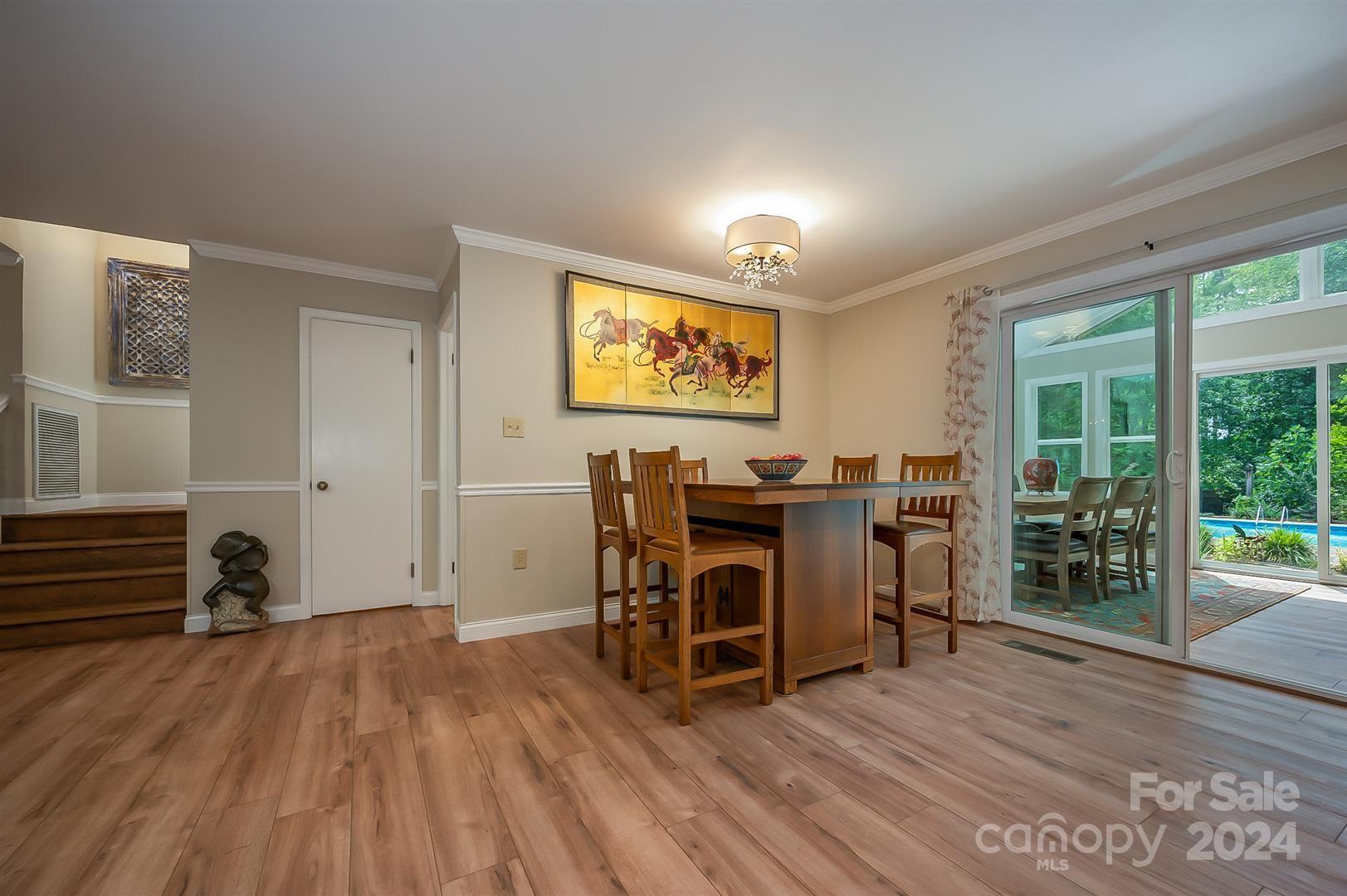 2316 Golf Course Road Columbus, NC 28722 - Photo 13 of 33 a view of a workspace with furniture and wooden floor