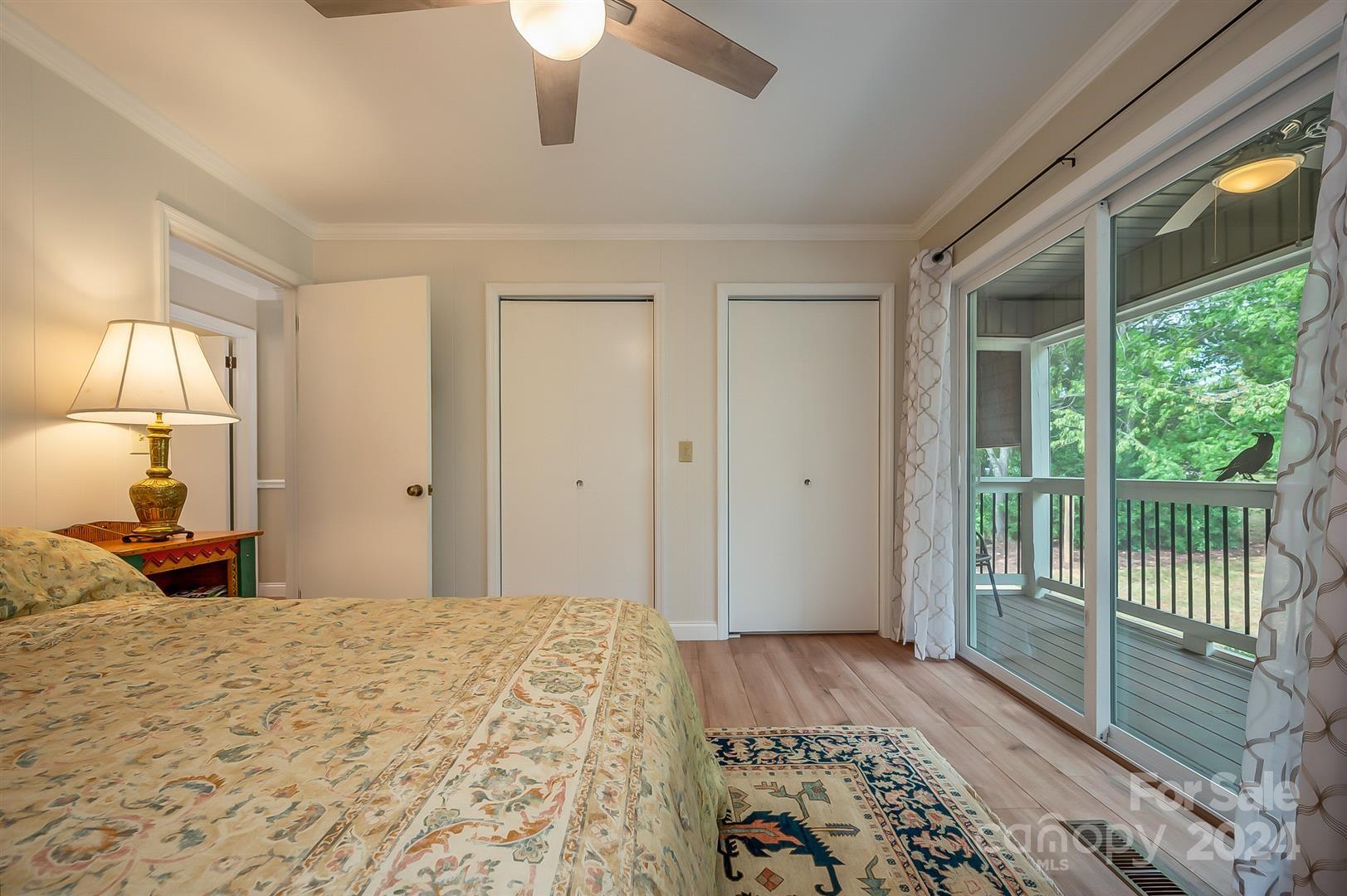 2316 Golf Course Road Columbus, NC 28722 - Photo 18 of 33 a bedroom with a bed and a large window