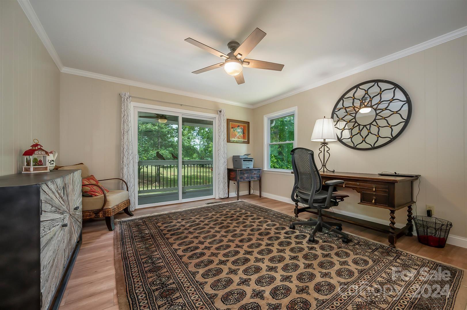 2316 Golf Course Road Columbus, NC 28722 - Photo 19 of 33 a living room with furniture a rug and a large window
