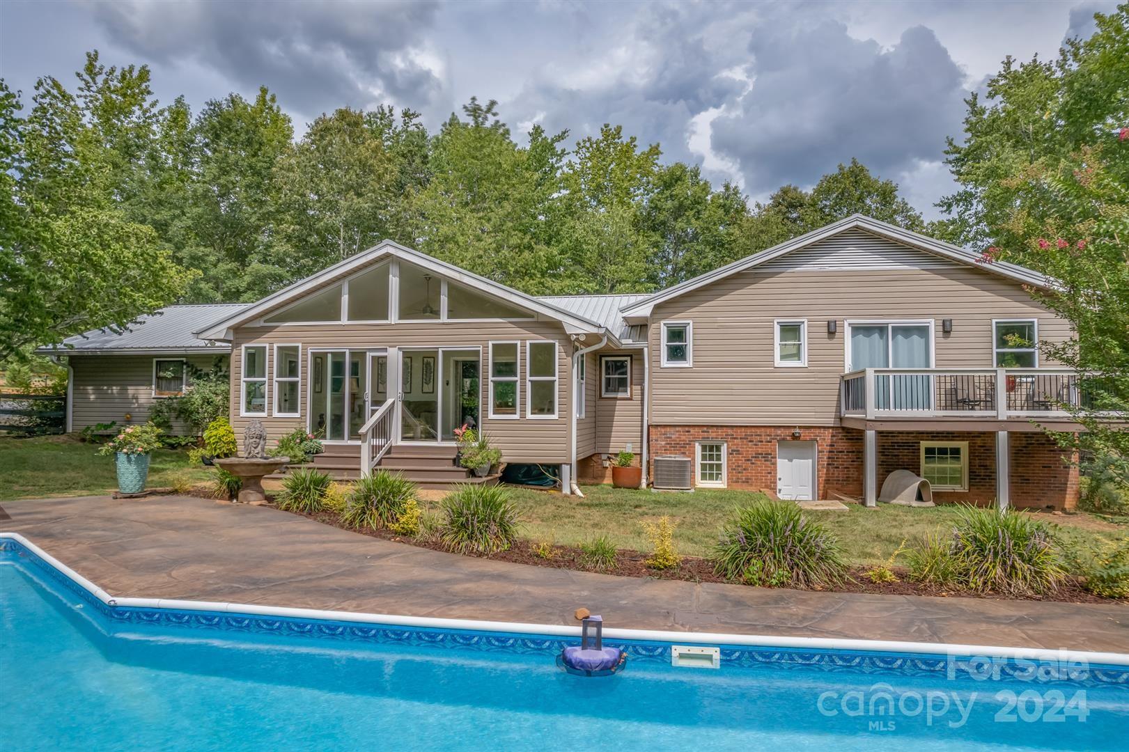 2316 Golf Course Road Columbus, NC 28722 - Photo 2 of 33 a front view of a house with a yard