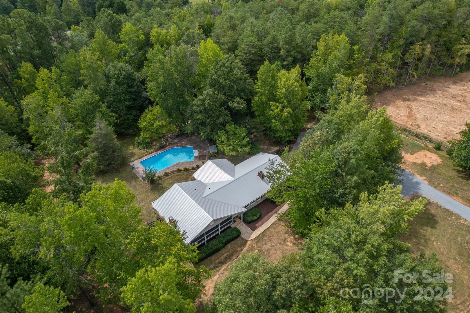 2316 Golf Course Road Columbus, NC 28722 - Photo 29 of 33 an aerial view of a house with a yard