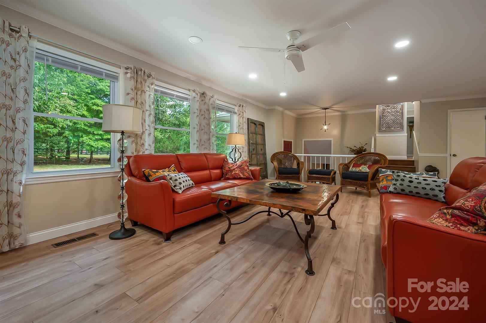 2316 Golf Course Road Columbus, NC 28722 - Photo 10 of 33 a living room with furniture wooden floor and window