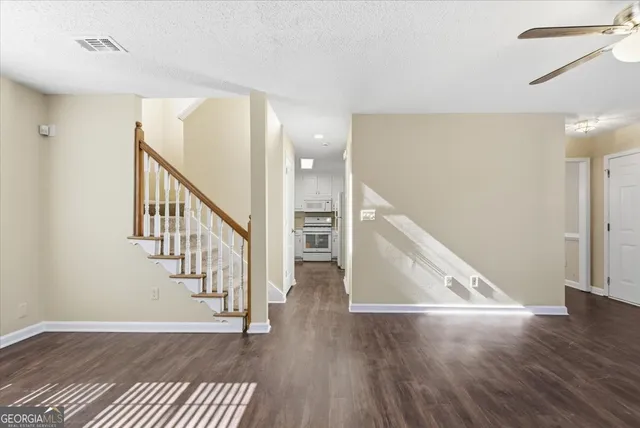 a view of entryway with wooden floor