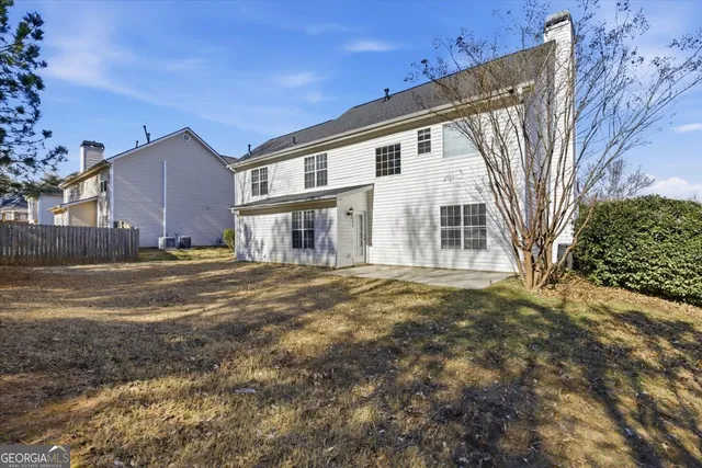 a view of a house with a big yard