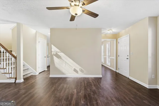 a view of an entryway with wooden floor