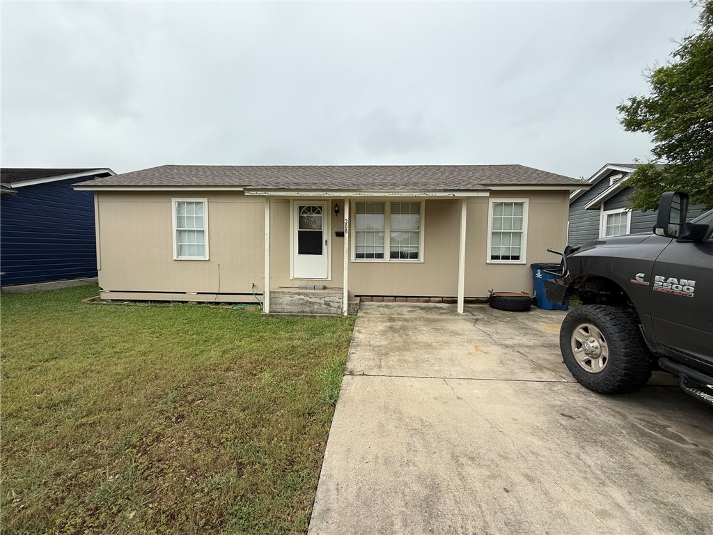 a car parked in front of white house